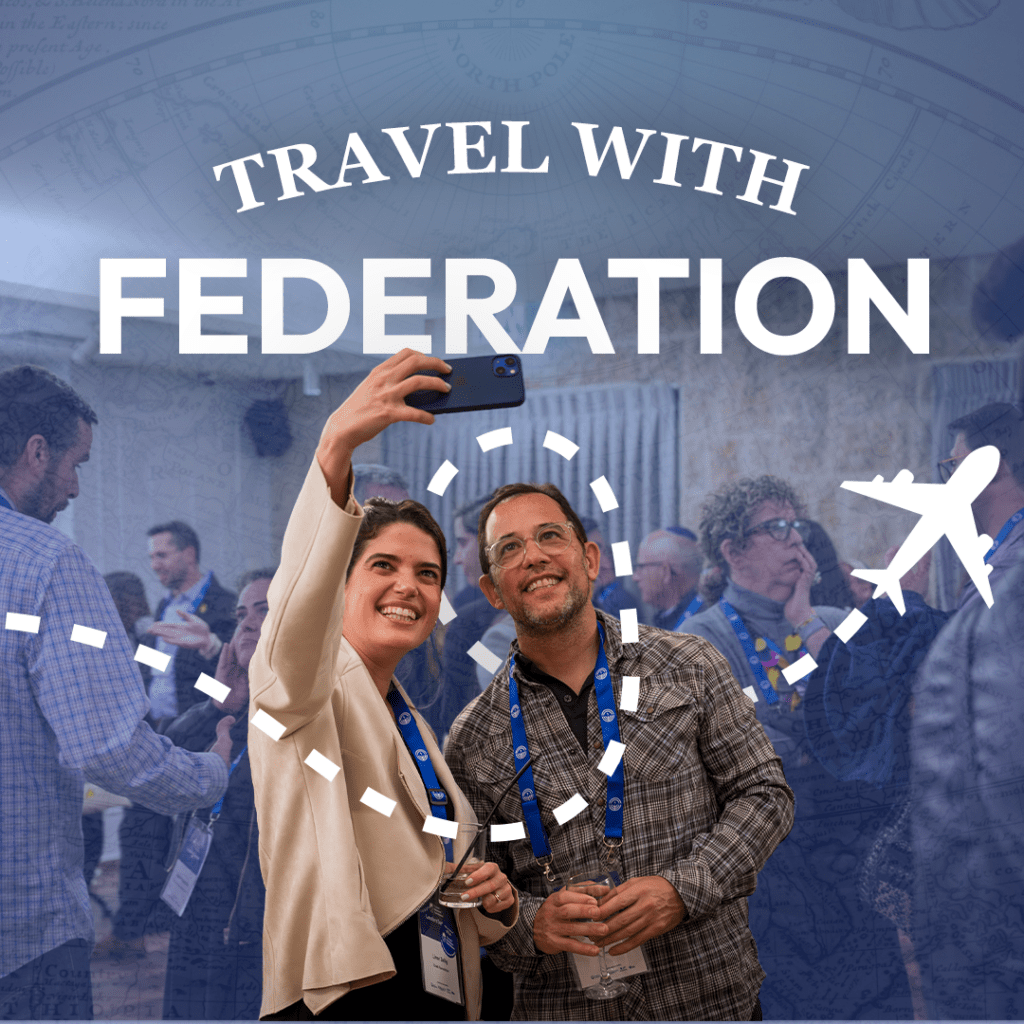 Two attendees pose for a selfie at a travel conference, with a bold 'Travel with Federation' headline and airplane graphics in the background.
