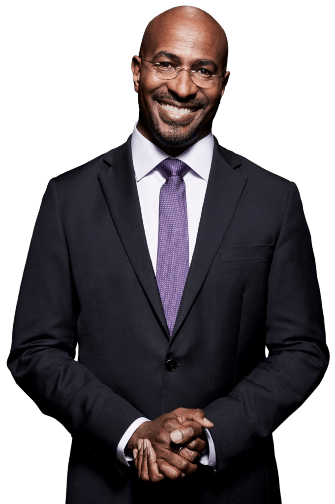 Smiling bald man in a dark suit and purple tie against a black background, hands clasped.
