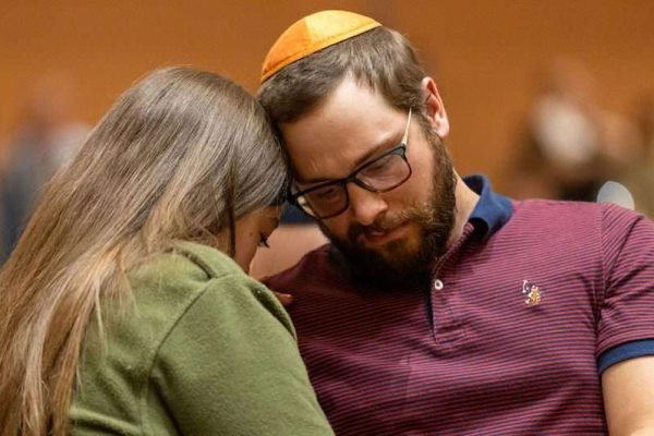 Two people embrace at an Israel rally
